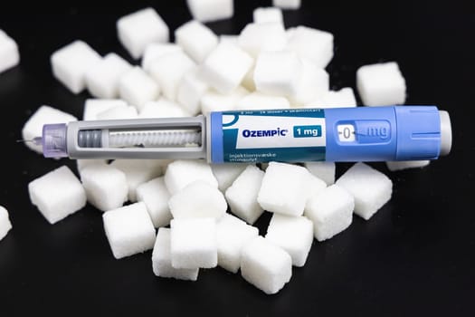 Ozempic Insulin injection pen on a dark background for diabetics and weight loss. Copenhagen, Denmark - February 16, 2025