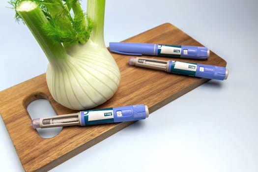 Ozempic Insulin injection pen and fennel vegetable root for diabetics and weight loss. High quality photo