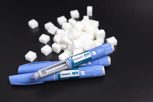 Ozempic Insulin injection pen on a dark background for diabetics and weight loss. Copenhagen, Denmark - February 16, 2025
