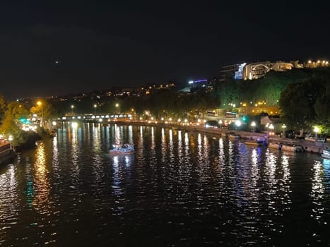 Night light city river landscape background summer town travel tourism black sky17 August 2024 Tbilisi Georgia. High quality photo
