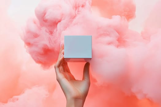 A graceful hand elegantly holds a blank cube set against a vibrant pink cloud, creating a captivating and dreamy atmosphere ideal for modern advertising.