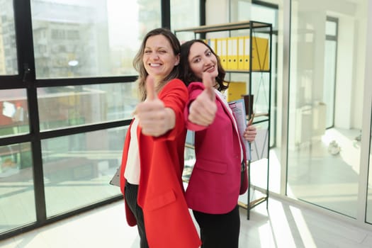 Businesswomen interacting professionally in the workplace.