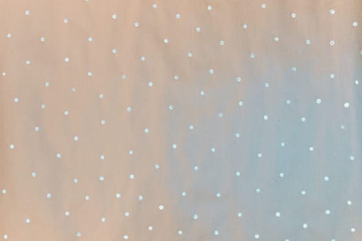 Gift wrapping paper texture. Painted paper, concept of small white dots, snowflakes.
