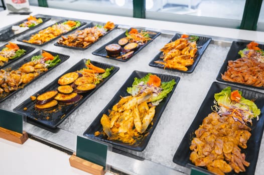 Asian buffet in hotel in Asia. Vietnamese food meat, seafood and vegetables at the self-service restaurant for breakfast