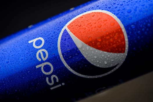 Gaziveren Cyprus -25.02.2025 A cold beverage can shines with droplets, showcasing its bright colors and inviting thirst-quenching appeal.