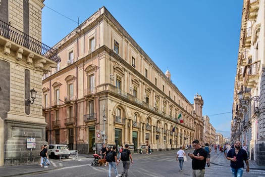 Catania. Italy - February 27, 2025: Palazzo Minoriti shines in Catania vibrant streets with its historic charm. Great for tourism promotions, city photography, and cultural narratives.