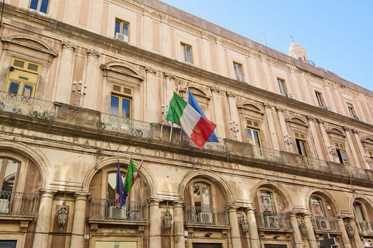 Catania. Italy - February 27, 2025: Palazzo Minoriti radiates historic allure along Catania lively avenues. Suited for travel advertisements, city heritage projects, and lifestyle photography.