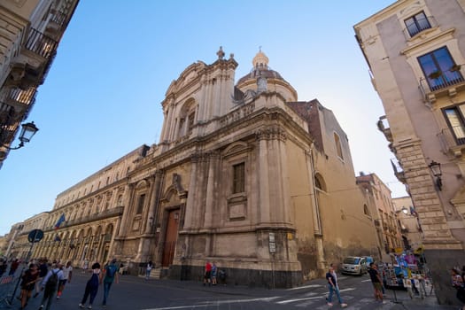 Catania. Italy - February 27, 2025: San Michele Arcangelo ai Minoriti stands as a historic gem in Catania. Great for tourism campaigns, religious architecture projects, and cityscape visuals, capturing Sicily cultural richness on a bright day.