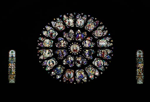 Stained glass windows illuminate Cathedral Saint-Etienne in Toulouse, showcasing its artistic heritage.