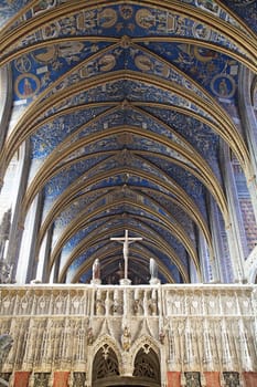 View of the stunning decorated ceiling in Sainte-Secile cathedral, capturing the vibrant colors and intricate designs.