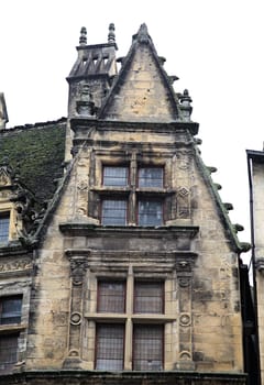 Details of a historic Maison de la Boetie in Sarlat-la-Caneda showcase the architectural heritage of this French commune.