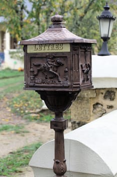 Decorative letterbox featuring detailed carvings of animals located in Sarlat-la-Caneda, a charming commune in France.