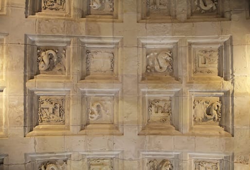 Elaborate ceiling with detailed stone carvings in Chambord Castle highlights architectural beauty and history.