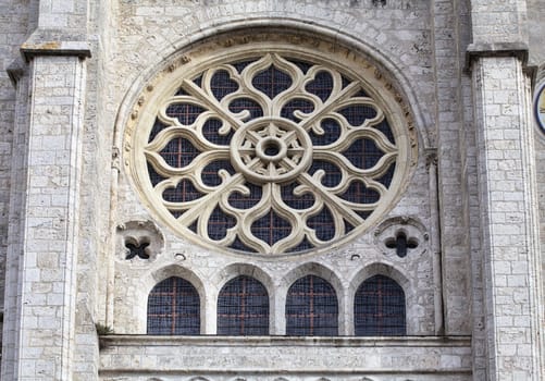 Rose window and elegant stone carvings of gothic church of Saint-Nicolas in Blois, France
