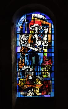This stained glass window at the Church of Saint-Nicolas illustrates a farmer surrounded by baskets of produce in Blois.