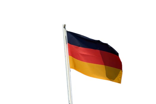 Colors of black, red, and gold flutter in the wind, symbolizing Germany's pride under a clear blue sky.