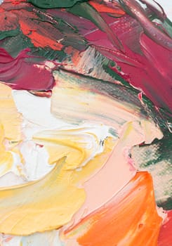 Palettes of oil paint reveal a dynamic composition where vibrant colors blend and contrast, highlighting the textured strokes made with a palette knife.