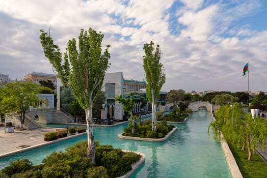 Baku, Azerbaijan - May 4, 2024: The Boulevard canals, also known as Little Venice, are surrounded by lush greenery