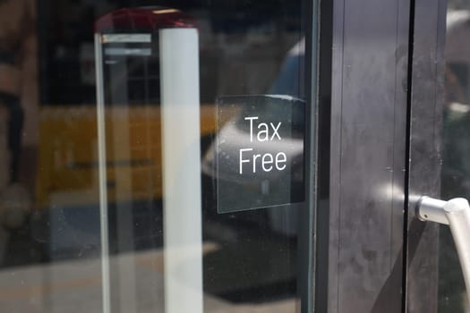 Sign indicating tax free shopping option at a retail location