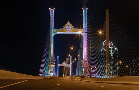 Bangkok, Thailand 10 Jan, 2025 - Beautiful scenery of Thotsamarachan Bridge (Rama IX Bridge) crossing Chao phraya river with evening sky in the background. use it as your Wallpaper, Poster and Copy space, Selective focus.