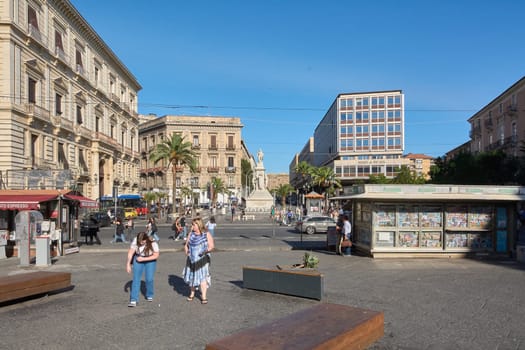 Catania. Italy - March 3, 2025: Iconic Vincenzo Bellini statue in Stesicoro Square, framed by Catania vibrant streets. Perfect for cultural exploration, travel photography, and heritage sites under.