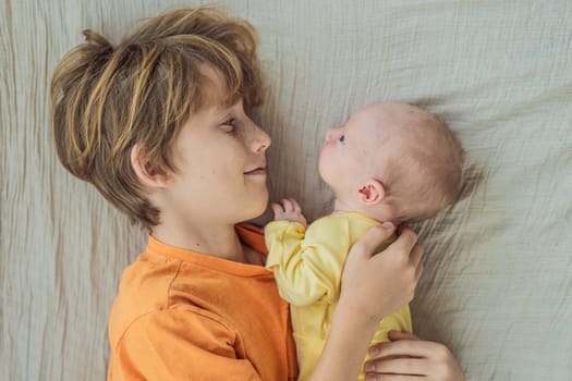 A young boy and his newborn brother lie together on a soft muslin blanket, sharing a tender sibling moment. A heartwarming scene of brotherly love, bonding, and the beginning of a lifelong connection.