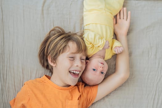 A young boy and his newborn brother lie together on a soft muslin blanket, sharing a tender sibling moment. A heartwarming scene of brotherly love, bonding, and the beginning of a lifelong connection.