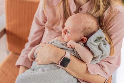 A mother lovingly embraces her newborn baby, holding them close to her chest. A tender moment of warmth, security, and deep maternal love, symbolizing bonding, comfort, and the unbreakable connection between mother and child.