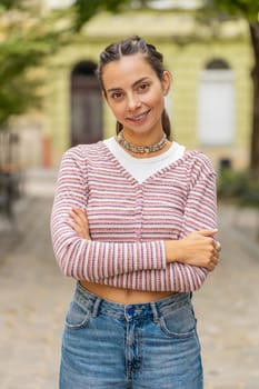 Portrait of happy young woman face with teeth braces smiling friendly open eyes glad expression looking dreaming resting relaxation feel satisfied good news outdoors. Pretty adult girl on city street
