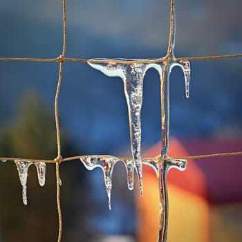 Beautiful icicles on the net. Concept for winter time, water and nature. Abstract background