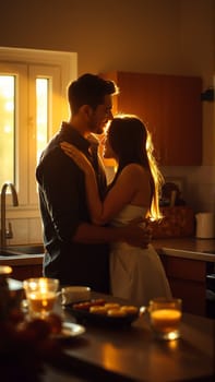 A married couple hugs in the morning in the kitchen. A man and a woman in love hugging each other in the rays of the morning sun. High quality photo