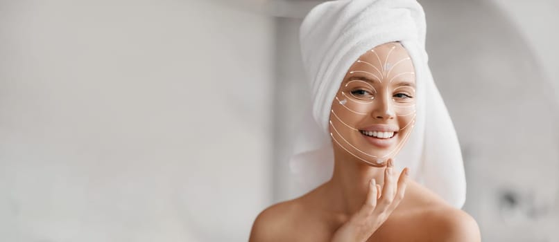 A woman smiles while applying a skincare treatment to her face, embodying relaxation and self-care. She is in serene spa-like environment, enhancing her beauty and rejuvenation experience, copy space