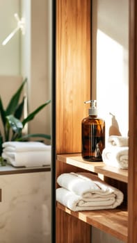 Spa treatment set, wooden shelf with neatly folded towels and dispensers for soap, cream, massage oil. High quality photo
