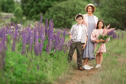 Caucasian family enjoying nature walk in lupine field.