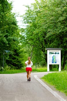 girl jogging in city park , sport