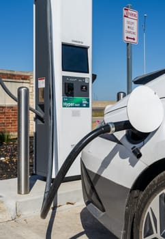 New Braunfels, TX - 1 March 2025: Hyundai Ioniq 6 being charged at Electrify America Hyperfast 350KW charging station in Texas