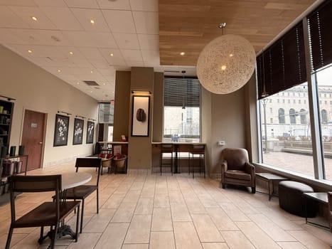 cozy cafe interior featuring stylish furniture, subdued lighting, and a warm, welcoming ambiance ideal for relaxation, conversation, and enjoying a cup of coffee or tea, good for multimedia content creation