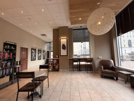 cozy cafe interior featuring stylish furniture, subdued lighting, and a warm, welcoming ambiance ideal for relaxation, conversation, and enjoying a cup of coffee or tea, good for multimedia content creation