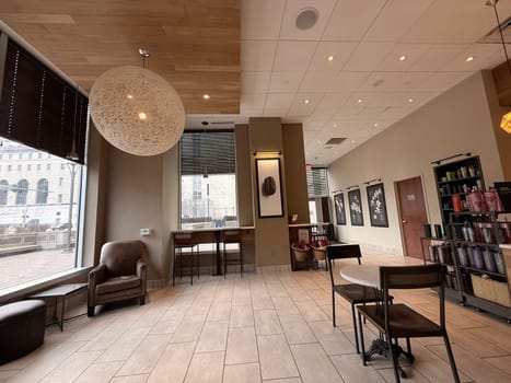 cozy cafe interior featuring stylish furniture, subdued lighting, and a warm, welcoming ambiance ideal for relaxation, conversation, and enjoying a cup of coffee or tea, good for multimedia content creation