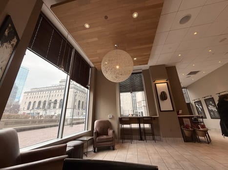 cozy cafe interior featuring stylish furniture, subdued lighting, and a warm, welcoming ambiance ideal for relaxation, conversation, and enjoying a cup of coffee or tea, good for multimedia content creation