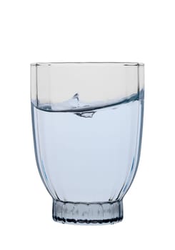 Clear glass holds shimmering water as it ripples, capturing the essence of refreshment and tranquility.