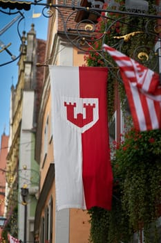 Coat of arms of the medieval town of Rothenburg ob der Tauber on a banner in the old town