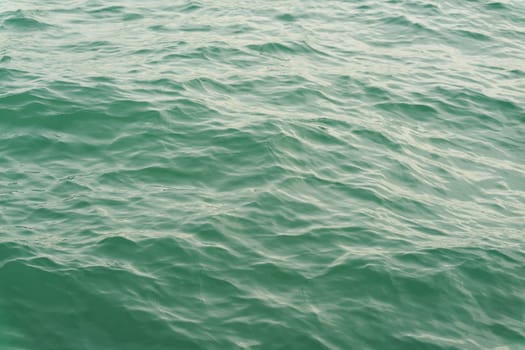 turquoise water surface with waves on Lake Constance, Bodensee in Germany