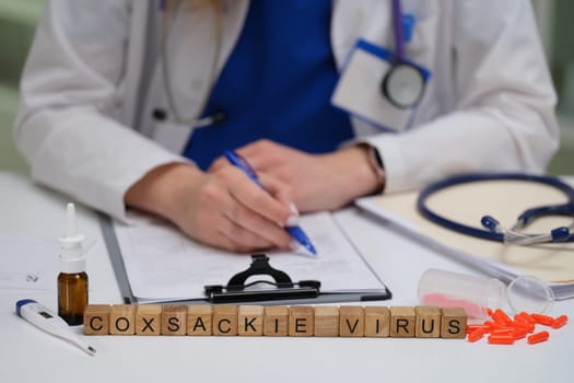 A healthcare professional drafting detailed notes on the Coxsackie virus, focusing on key medical insights