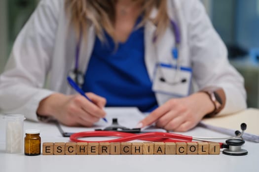 A medical professional diligently studying Escherichia coli while utilizing notes and various laboratory tools