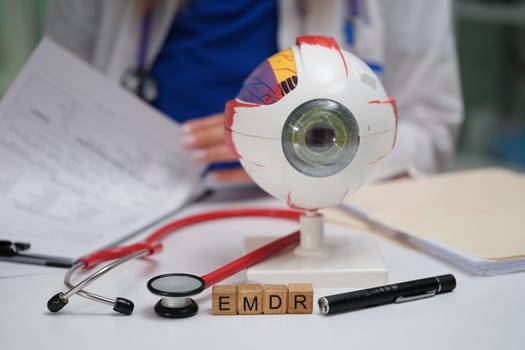 A dedicated doctor prepares for an important eye health consultation using specialized EMDR therapy tools