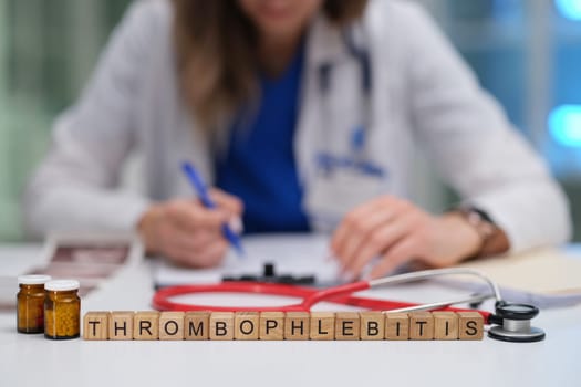 A medical professional is engaging in the study of thrombophlebitis while keeping treatment supplies in view
