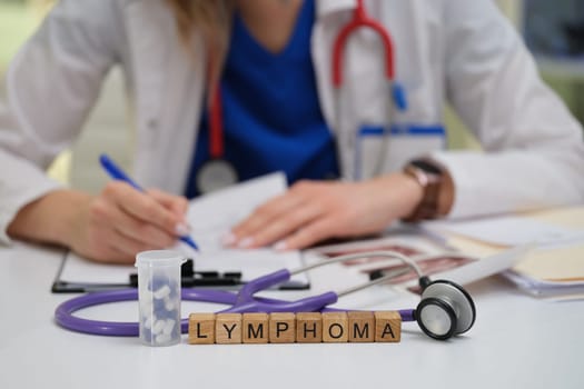A dedicated doctor writes detailed notes on lymphoma, showcasing thorough medical research and patient care