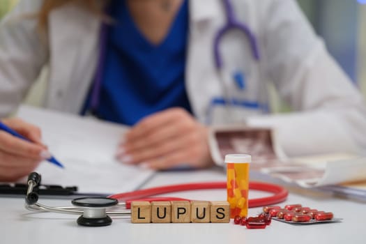 A dedicated healthcare professional thoroughly reviews lupus treatment options, utilizing medication and a stethoscope