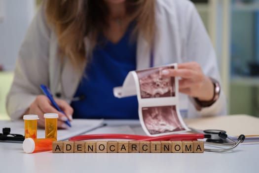 A medical professional is reviewing images and data on adenocarcinoma for patient evaluation and diagnosis